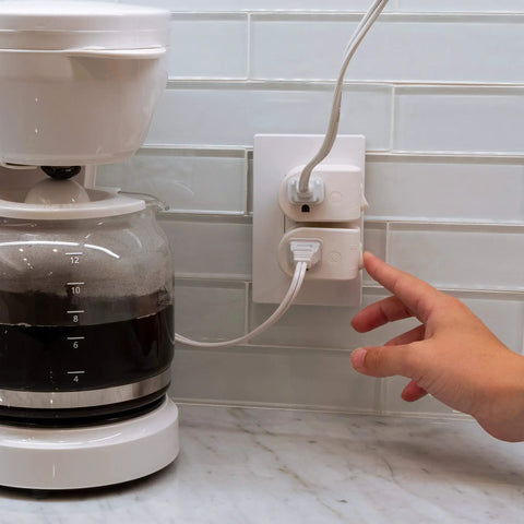 Child turning on grounded on off plug in power switch white energy efficient UL listed 15A 120VAC 1800W space saving near coffee maker.