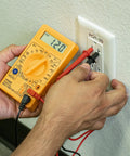 Digital Multimeter And Diode And Transistor Tester For Automotive And Home Use Must Have AC DC Volt Meter Battery Tester Analog Multimeter Kit Voltage Meter For Cars And Electronics in use testing wall socket.