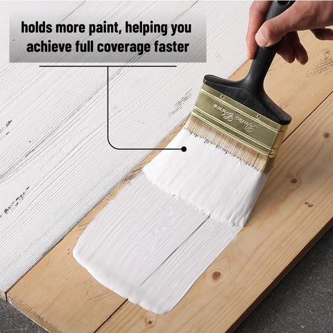 Hand using Workhorse Deck Stain Brush Set for Wood Projects 4 Pack 4 Inch Wide Soft Tip Brushes with Brass Ferrule for smooth paint application