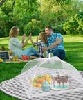 Outdoor Mesh Food Covers Set 10 Pack Pop Up Tents for Picnic and Camping covering food at a family picnic, keeps bugs off food.