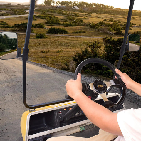 Heavy Duty Golf Cart Steering Wheel With Slick Non Slip Grip Fits Club Car EZGO And Yamaha Models For Smooth Handlein And Reliable Daily Cruisin in use while driving on a path.