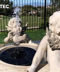 Solar Powered Bird Bath Fountain Pump Kit With 4 Nozzle Heads, Quiet Submersible Water Pump displayed in garden setting