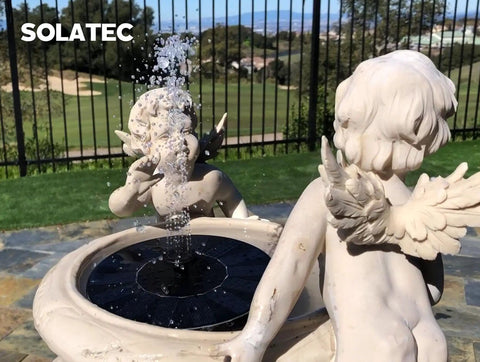 Solar Powered Bird Bath Fountain Pump Kit With 4 Nozzle Heads, Quiet Submersible Water Pump displayed in garden setting