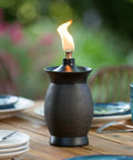Tabletop view of Resin Jar Torch With 4-In-1 Design, 64-Inch Outdoor Torch For Patio Garden And Lawn, Weather-Resistant Stone Color