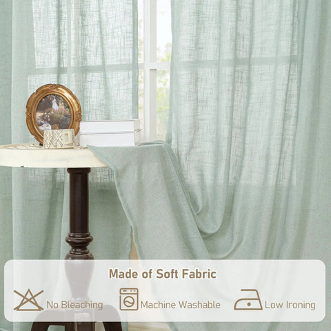 63 Inch Light Sage Linen Curtains Set Of 2 Semi Sheer Panels with back tabs and rod pocket hanging on a window for decoration.