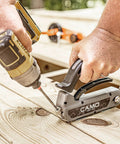 Edge Deck Screws For Hidden Fastening One And Seven Eighths Inch ProTech Coated 1750 Count Built For Pressure Treated Lumber Hardwood Cedar And Composite Decks Angled Installations being used with a drill on a wooden deck