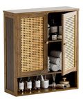 Front view of Rattan And Bamboo Bathroom Wall Cabinet With Doors And Shelves For Over Toilet Space Saving Hanging Storage Organizer In Walnut Finish With Adjustable Interior Shelves Fixed Top And Open Lower Shelf, featuring rattan doors and visible interior contents like toiletries and towels.