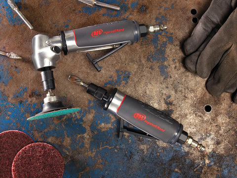 Heavy Duty 1/4 Inch Collet Air Die Grinder Featuring Ergonomic Grip and Mean Knockout Motor on a workbench with abrasive pads.
