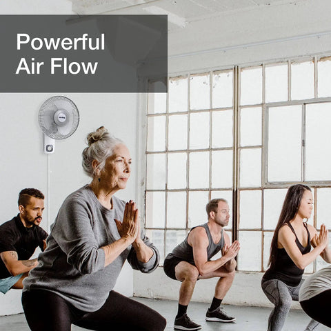 Commercial Grade Oscillating Wall Mount Fan, 12 Inch White Workhorse shown in a fitness class setting