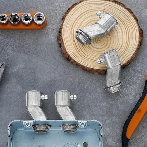 Four Pack Half Inch EMT To Box Offset Connectors With Set Screw And Lock Nut Conduit Fittings For Galvanized Steel Electrical EMT Conduit Zinc Die Cast displayed on wooden background with tools