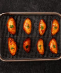 Nonstick Mesh Air Fryer Basket Set For Oven with chicken pieces, stainless steel grill tray, 360 degree air circulation, top view