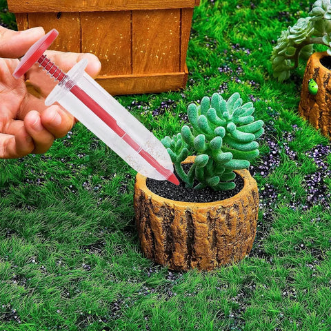Handheld Seed Spreader And Manual Planter Tool With Ergonomic Grip being used in a garden with small potted plant, precise planting