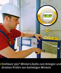 Man using a Heavy Duty Torpedo Spirit Level With Knockout Rare Earth Magnet And Carry Bag A Real Job Site Beast Built From Solid Aluminum in construction.