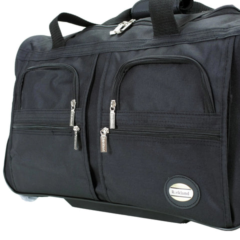 Rockland rolling duffel bag, black, 22 inches; side view with multiple zip pockets and a Rockland logo patch