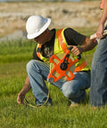 Person using Hi Viz Orange Fiberglass Tape Measure Half Inch By One Hundred Meters Dual Sided SAE And Metric Tape With Open Four Arm