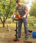 Man using Gas Powered Post Hole Digger With 43cc 2-Stroke Engine, 8 Inch Auger Bit, 31.5 Inch Drill Depth in garden setting