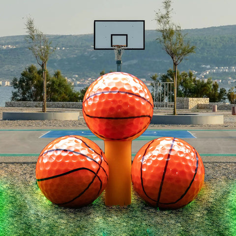 Custom Photo Logo Or Text Basketball Golf Balls 12 Pack With 360 Degree Print staged on outdoor basketball court