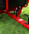 Close-up of the hitch and tire of Rock Solid Six Hundred Fifty Pound Poly Dump Cart For Tough Job Site Hauling.