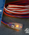 Heavy Duty Outdoor Indoor Extension Cord 100 Foot 12/3 SJTW With Beefed Up Contractor Grade Durability UL Certified All Weather Jacket Red White Blue Built For Tough Jobsite Power, with lighted end and patriotic color design.