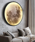 Moon Wall Light 19.7 Inch Plug In Modern LED Wall Lamp 24W Black Sconce With Warm 3000K Glow in living room decor