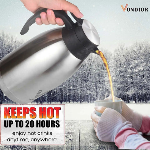 Pouring coffee from 68 oz stainless steel thermal carafe with 12h heat, 24h cold retention in a snowy outdoor scene.