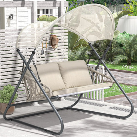 Beige Two-Seat Outdoor Porch Swing With Canopy, Hanging Glider Bench With Thick Cushions, Rustproof Metal Frame in garden setting