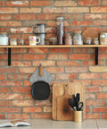 Quarter Inch Thick Heavy Duty Shelf Brackets 4 Pack For Rustic Farmhouse Floating Shelves Industrial Wall Mount With Screws And Anchors Built To Last And Supports Up To Sixty Six Pounds used on a kitchen shelf with jars and mugs