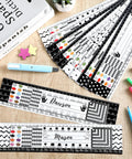 48 Pack Black White Painted Dots Classroom Name Plates Desk Name Tags For Kids Alphabet And Multiplication Desk Markers shown on table