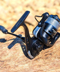 Loaded Spinning Reel With 10lb Braided Line, Carbon Disc Drag, 5.2 To 1 Gear, 7 Plus 1 Stainless Bearings on wooden surface