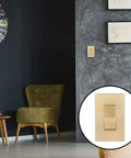 Gold 3 Way Decorator Paddle Light Switch DIY Friendly Single Pole Or Three Way mounted on gray wall, living room view.