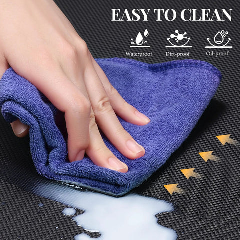 Close-up of purple cloth cleaning spilled liquid on Heavy-Duty Anti-Fatigue Standing Mat 39 By 20 Inches With Safety Yellow Border built for long shifts.