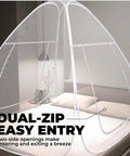 Pop Up Mosquito Net For Bed And Camping Indoor Outdoor Bug Mesh Shelter Lightweight Portable Tent with dual-zip opening on bed.