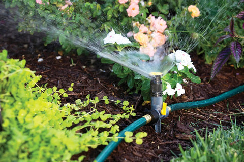 Multi Adjustable Lawn Sprinkler On A Spike With Built In Flow Control, Reaches Up To 30 Feet watering flower bed