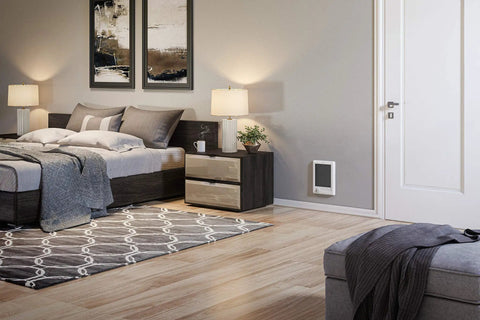 Bedroom with Go To Electric Wall Heater With Thermostat Complete Unit CSC202TW 240 And 208 Volt 2000 And 1500 Watt mounted on wall.