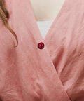 20 Piece Set Of Hidden Clothes Buttons With Resin Cherry Safety Brooch Closures For Shirts Pants And Hats Fashion collar pin on pink top.