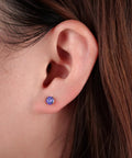 Top Shelf Implant Grade Titanium Screw Back Earrings Hypoallergenic Nickel Free Frame Crafted For Sensitive Skin With Fresh Gemstone Settings, purple stone, close-up on ear.