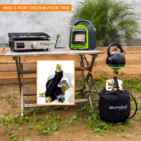 Three Port Propane Distribution Tree For Camping Connects Three One Pound Appliances To A Standard BBQ Tank Grillin Ready Safe Easy Setup Black And Gold placed on a camping table with propane appliances.