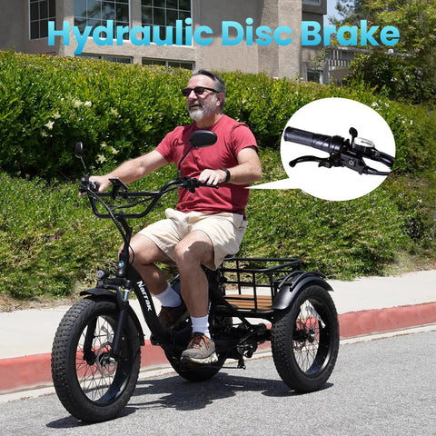 Person riding a Fat Tire Electric Tricycle For Adults Foldable Three Wheel E Trike with hydraulic disc brake focus inset.