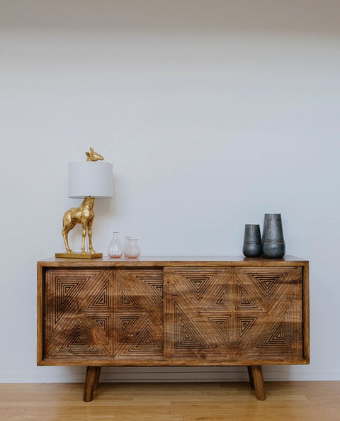Distressed Gold Giraffe Table Lamp With White Linen Shade on a wooden console with vases, Playful Resin Animal Accent Light, 27.75 Inch Tall