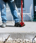 Get your hands on this Marshalltown Qlt Manual Rebar Bender, a 34-inch tool bending rebar on a concrete surface.
