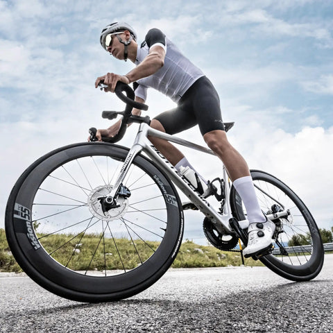 Cyclist using Assioma PRO RS-2 Dual Sensing Pedal Based SPD SL Road Power Meter With Bluetooth and ANT+ Connectivity for performance tracking