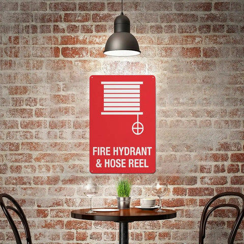 Outdoor Emergency Fire Hydrant And Hose Reel Safety Sign 8x12 inch wall plaque in a rustic cafe setting with red brick wall.