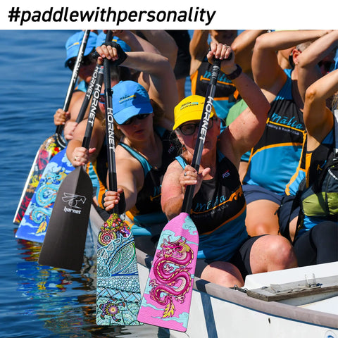 Group paddling in a dragon boat with colorful Sting Plus Dragon Boat Paddle For Dope Racing, Adjustable Carbon Fiber 3K Build.