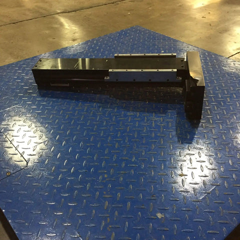 Clutch Kr55 Single Long Nut Linear Guide Actuator on blue diamond plate surface, designed for precision motion control.