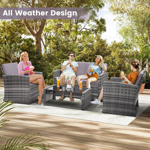 People enjoying Four-Piece Outdoor Patio Furniture Set With Wicker Rattan Modular Sectional Sofa With Cozy Cushions And Glass Table All Weather Conversation Set For Garden Porch Backyard And Patio Light Gray.