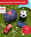 Kids First Aid Kit 246-Piece Bundle For Travel, Home, And Car Emergency Needs displayed on grass with toys and umbrella.