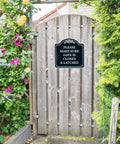 Top Shelf Outdoor Security Warning Placard Please Make Sure Gate Is Closed And Properly Latched on wooden gate with greenery.