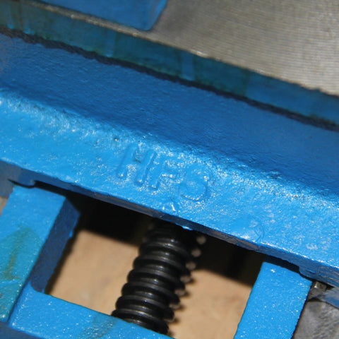 Close-up of blue ductile iron HFS labeled component of Three Inch Cross Slide Vise For Drill Press And Milling Projects Built Tough