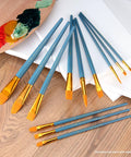 Zip N Close 12 Piece Brush Set In Vinyl Pouch for Acrylics and Watercolor on wooden surface with paint palette