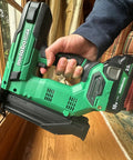 Person holding 18V MultiVolt Cordless Brushless Impact Driver And 18 Gauge Brad Nailer Combo Kit For Framing And Finishing.